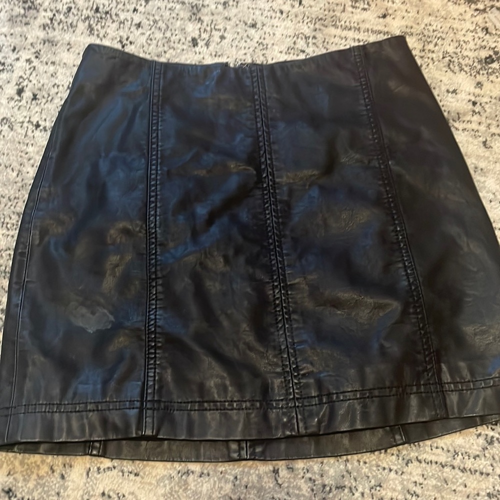 Zip up black leather mini skirt. Free people